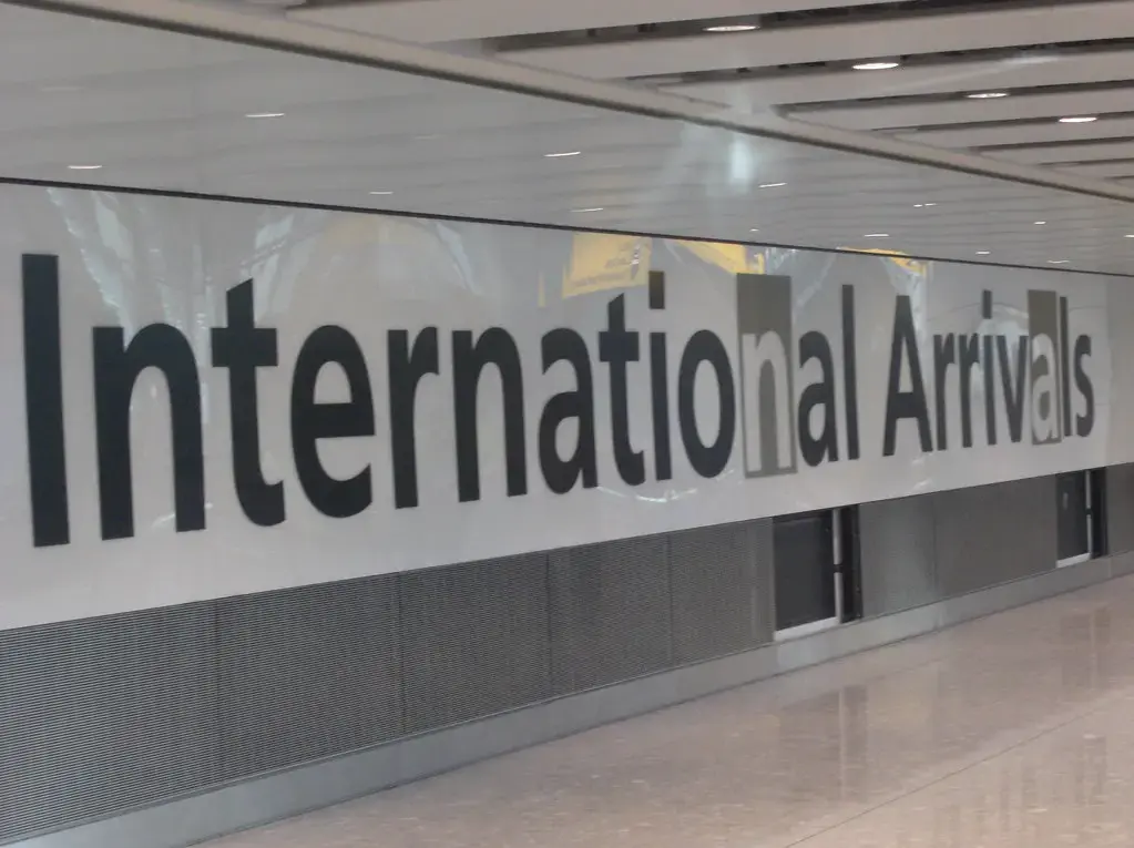 The International Arrivals sign at Heathrow Terminal 5