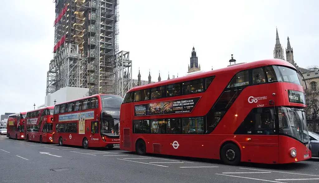 Red London buses on Westminster Bridge