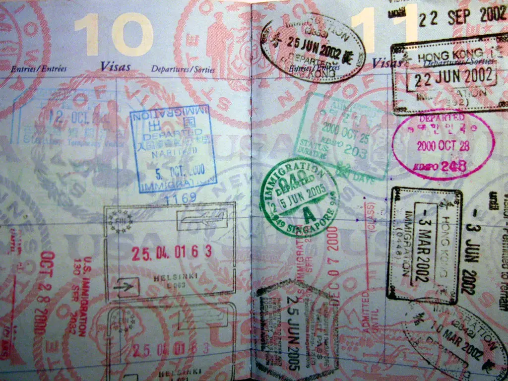 Passport pages covered in entry and exit stamps